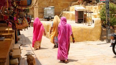Indian women walking on city street