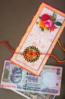Traditional Indian jewelry with money banknotes and greeting card