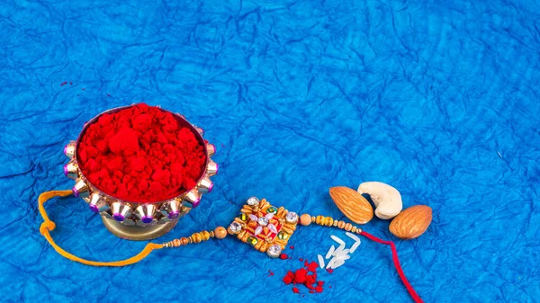 Traditional Indian Jewelry Rice Spice Peanuts Blue Background — Fotografie, imagine de stoc
