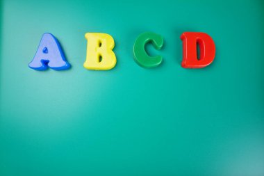 ABCD letters on green background 