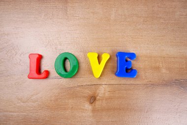 'Love' word wooden background