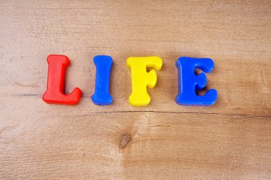 'Life' word wooden background