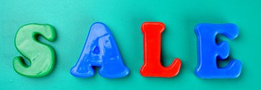 'Sale' word on green background