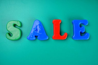 'Sale' word on green background