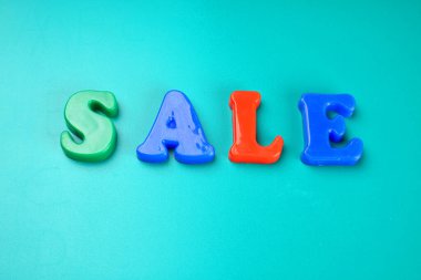 'Sale' word on green background