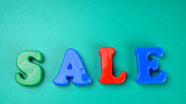 'Sale' word on green background