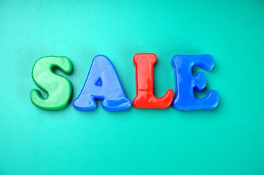 'Sale' word on green background