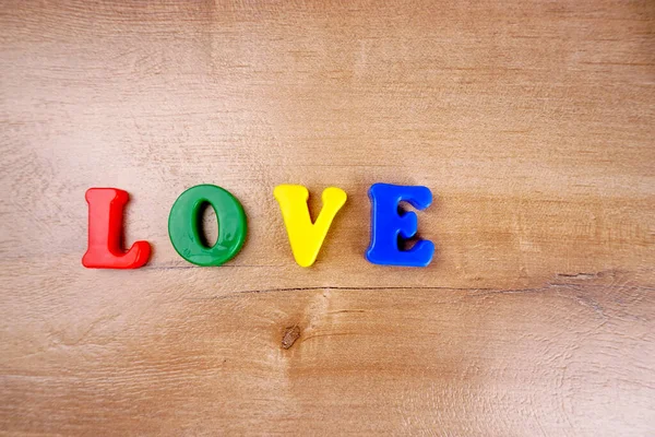 'Love' word wooden background