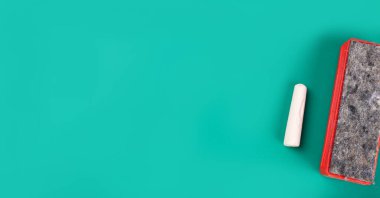 Chalk and washcloth on green background