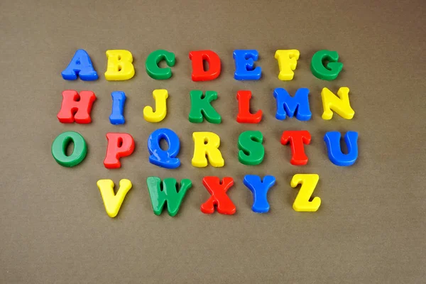 Colorful English Alphabet Brown Background — Fotografia de Stock