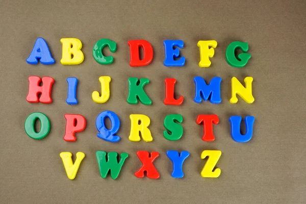 Colorful English Alphabet Brown Background — Fotografia de Stock