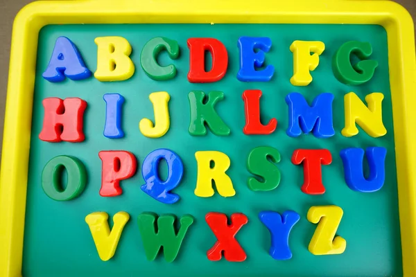 Colorful English alphabet on childish school blackboard