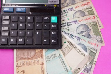 Calculator with Indian money banknotes