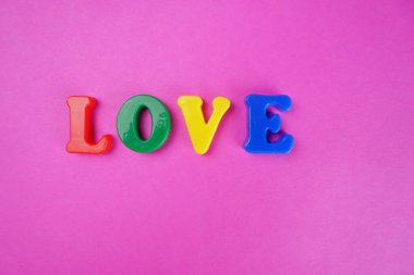 'Love' word on pink background