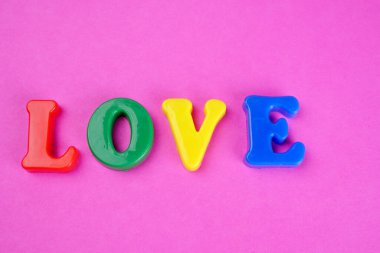'Love' word on pink background
