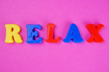 'Relax' word on pink background