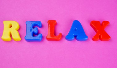 'Relax' word on pink background