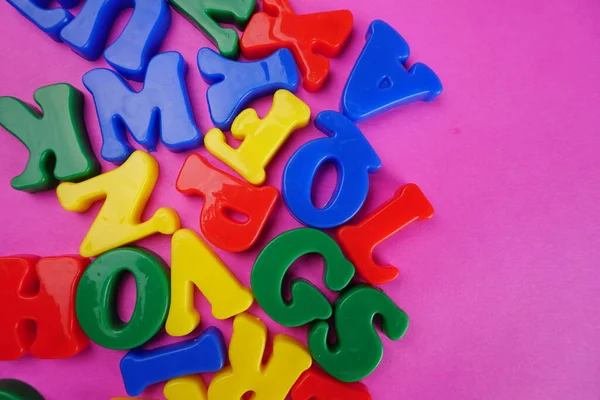 Colorful English letters on pink background