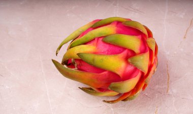Fresh ripe dragon fruit on marble background