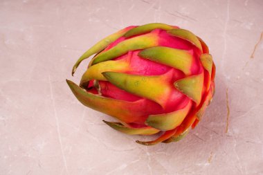Fresh ripe dragon fruit on marble background