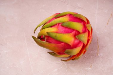 Fresh ripe dragon fruit on marble background
