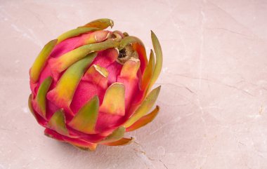 Fresh ripe dragon fruit on marble background