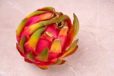 Fresh ripe dragon fruit on marble background