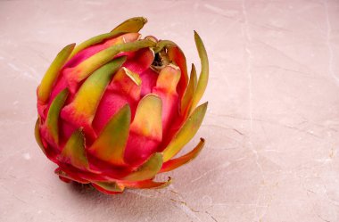 Fresh ripe dragon fruit on marble background