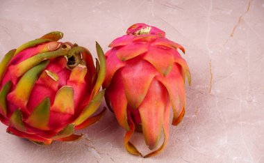 Fresh ripe dragon fruit on marble background
