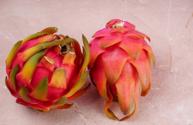 Fresh ripe dragon fruit on marble background