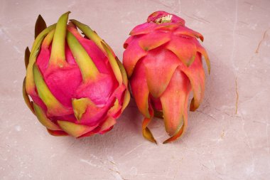 Fresh ripe dragon fruit on marble background