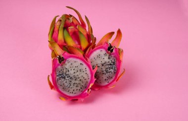 Fresh ripe dragon fruit on pink background