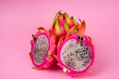 Fresh ripe dragon fruit on pink background