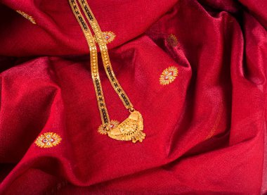 Mangalsutra or Golden Necklace to wear by a married hindu women, arranged with beautiful backgrond. Indian Traditional Jewellery.