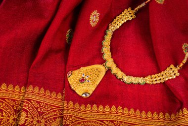 Golden Necklace to wear by a married hindu women, arranged with beautiful backgrond. Indian Traditional Jewellery.