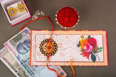 Raakhi traditional Indian wrist band which is a symbol of love between Brothers and Sisters. Raksha Bandhan Greeting.