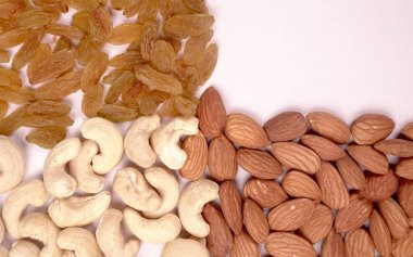 Variety mix of dried fruits and nuts on white background. Concept of Healthy fitness super food