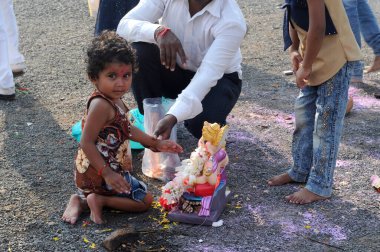 People with Hindu statue in India