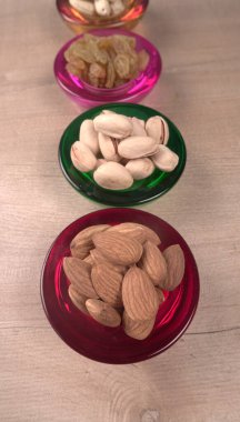 Variety mix of dried fruits and nuts on wooden background. Concept of Healthy fitness super food