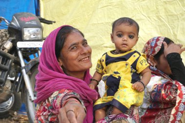 Mother with her baby kid in India