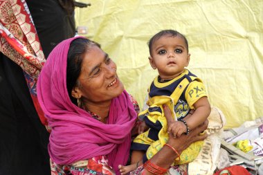 Mother with her baby kid in India