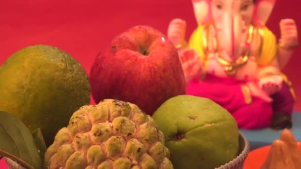 Ganesha Hindu Statue Bowl Fruits Red Background — Stock Video