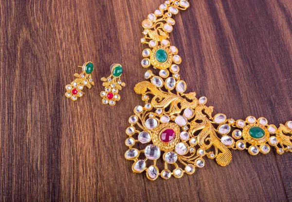Beautiful jewelry necklace and earrings with precious stones
