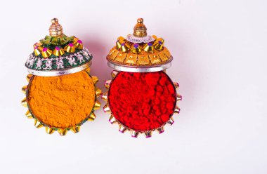 Beautifully Decoration for festival celebration to worship, haldi or turmeric powder and kumkum, flowers with leaves.Copy space.