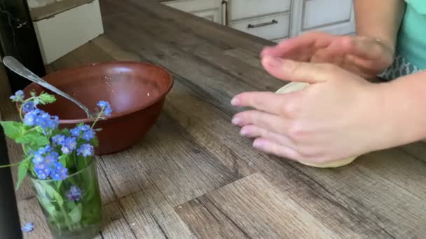 Little kid tasting fresh dough on the sly at home — Wideo stockowe