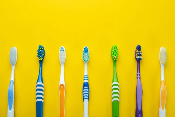 Toothbrushes Yellow Background Health Care Dental Hygiene Space Text Top — Stock Photo, Image