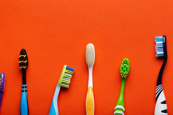 Toothbrushes Orange Background Concept Toothbrush Selection Oral Cavity Care Dental — Stock Photo, Image