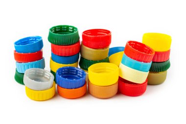 colorful plastic caps on white background, recycle for environment concept. Separate waste sorting.