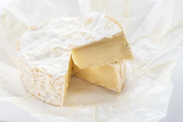 Camembert cheese on white background. French cheese.