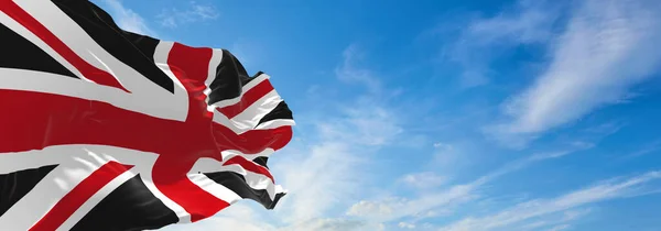 Reino Unido Bandeira Preta Vermelha Fundo Céu Nublado Pôr Sol — Fotografia de Stock